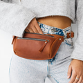 Warm Weathered Tan Asymmetrical Crescent Hip Storage Pouch With Dual Front Slide-Fastener Slots And Swivel Clasp Connect Fixtures