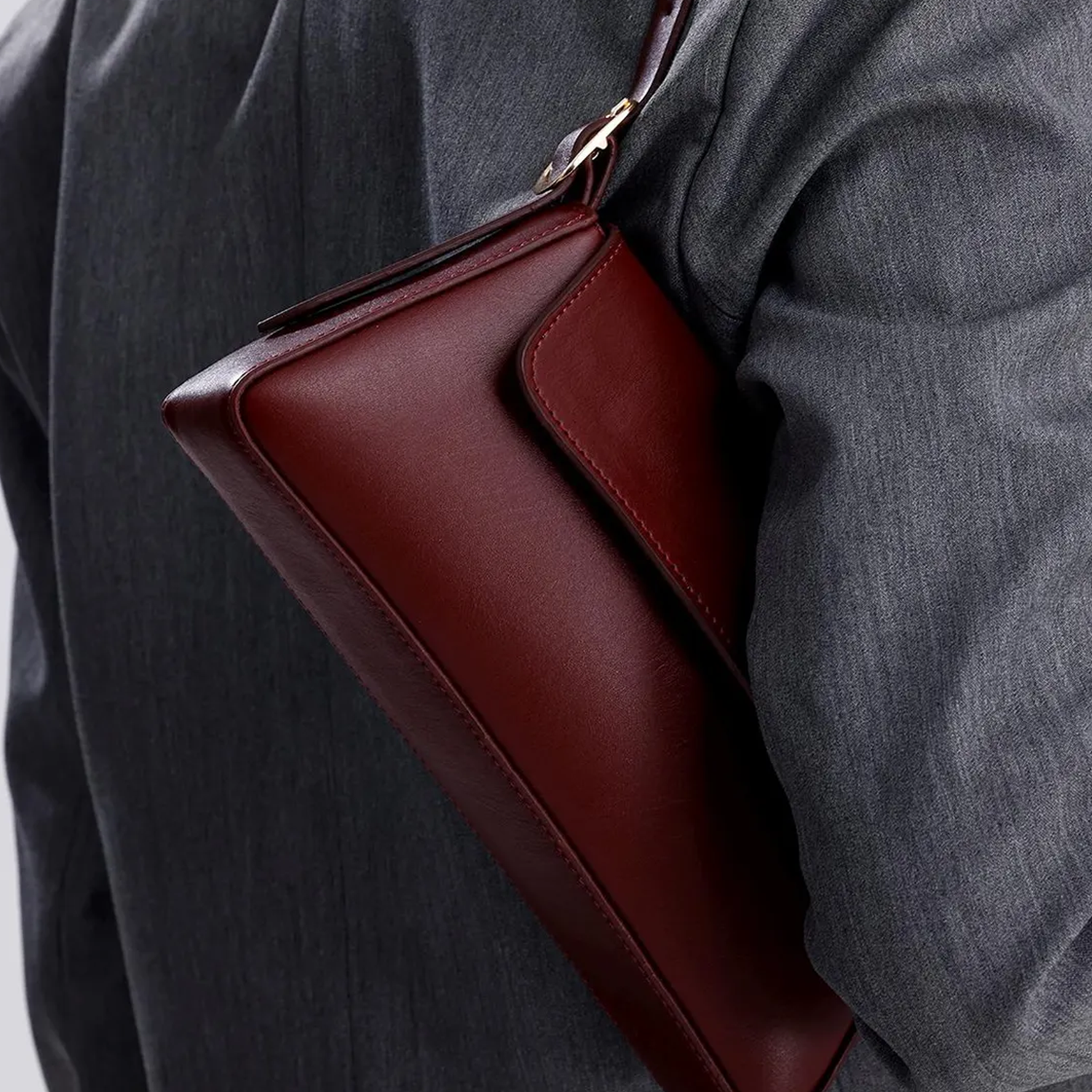 Deep Bordeaux Burgundy Slim Elongated Rectangular Carryall With Centered Overlay Flap And Single Metallic Swivel Grip Loop