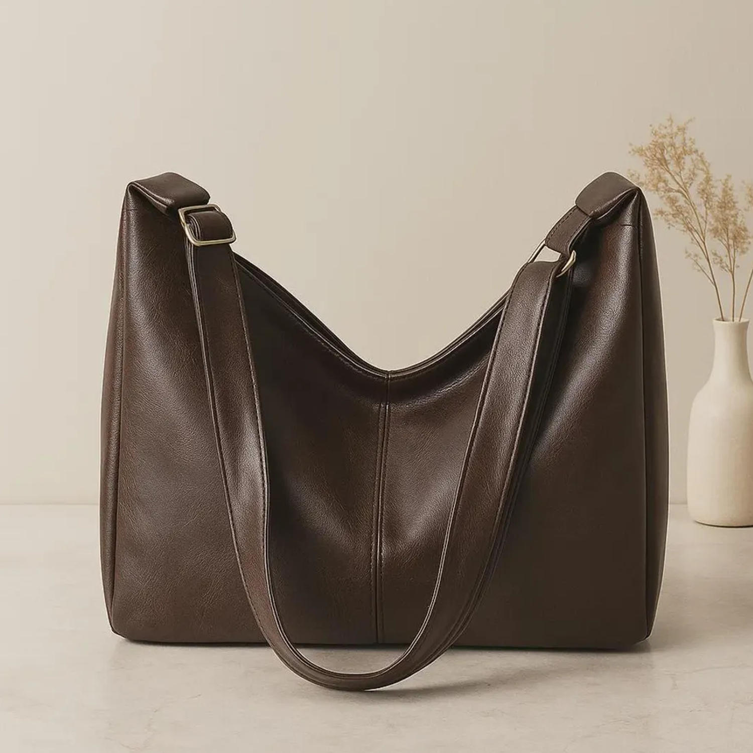 Soft Slouchy Trapezoidal Carryall With Central Vertical Stitch Seam And Wide Metallic Ring Hanging Fixture