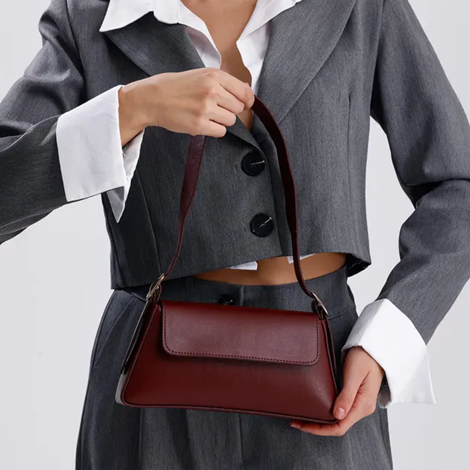 Deep Bordeaux Burgundy Slim Elongated Rectangular Carryall With Centered Overlay Flap And Single Metallic Swivel Grip Loop